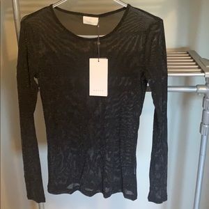 Shimmery top. See through. Never worn.